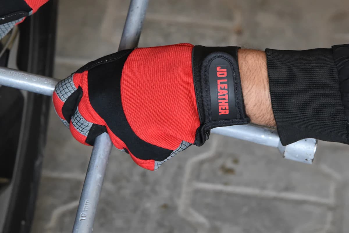 Technician using a wheel brace to remove wheel nuts