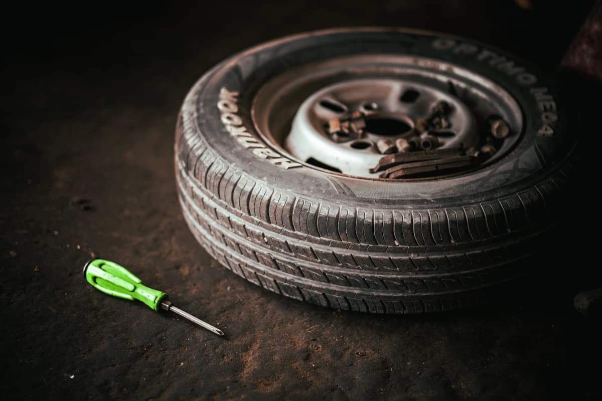 Car wheel and tyre removed for replacement – Bath, Somerset