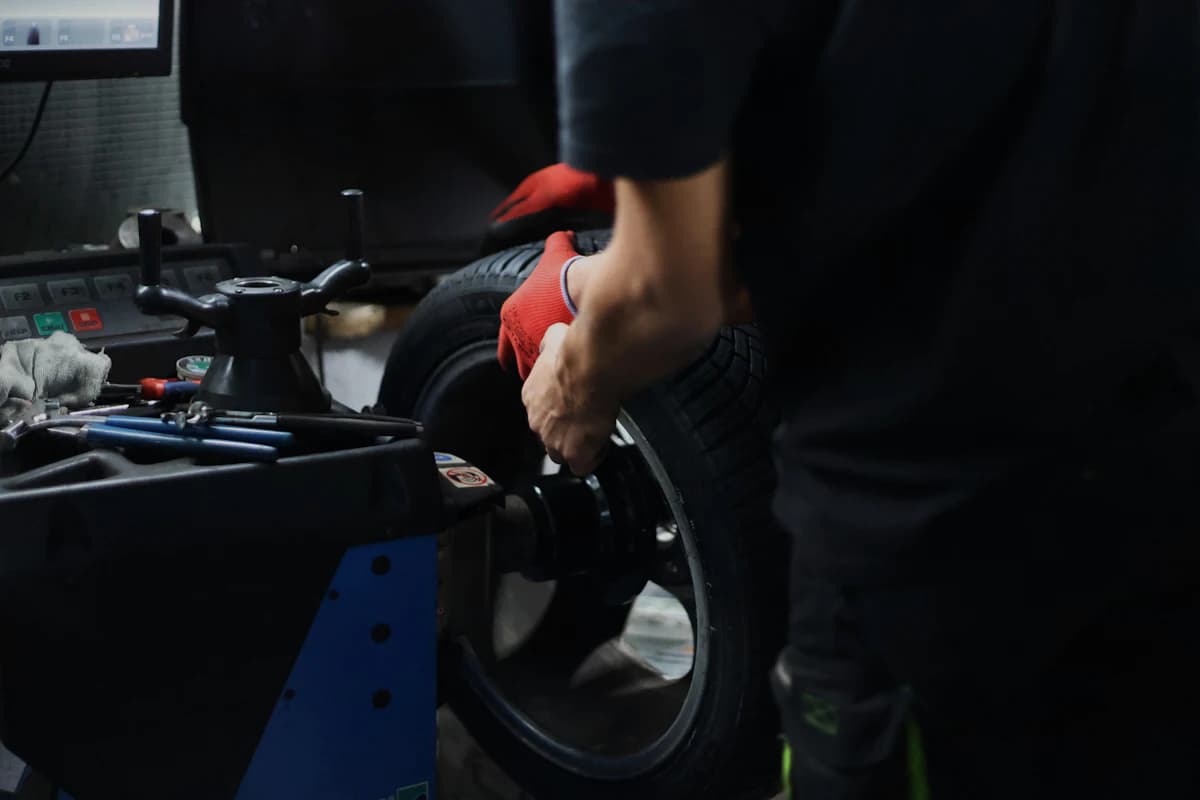 Tyre being mounted on a wheel balancing machine